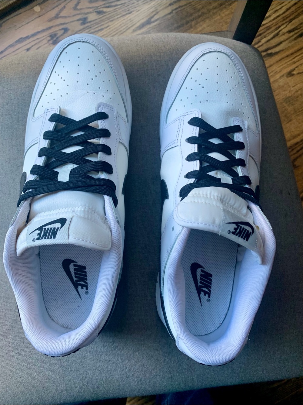 Nike White and Black Low-Top Sneakers with Black Swoosh